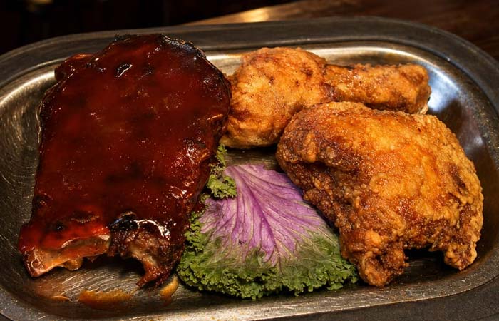 Barbecued ribs and fried chicken at Libertys, a Downtown Red Wing MN favorite, with leafy garnish.