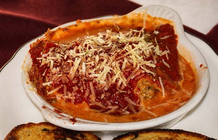 Baked manicotti topped with tomato sauce and cheese, served at Libertys in Red Wing MN.