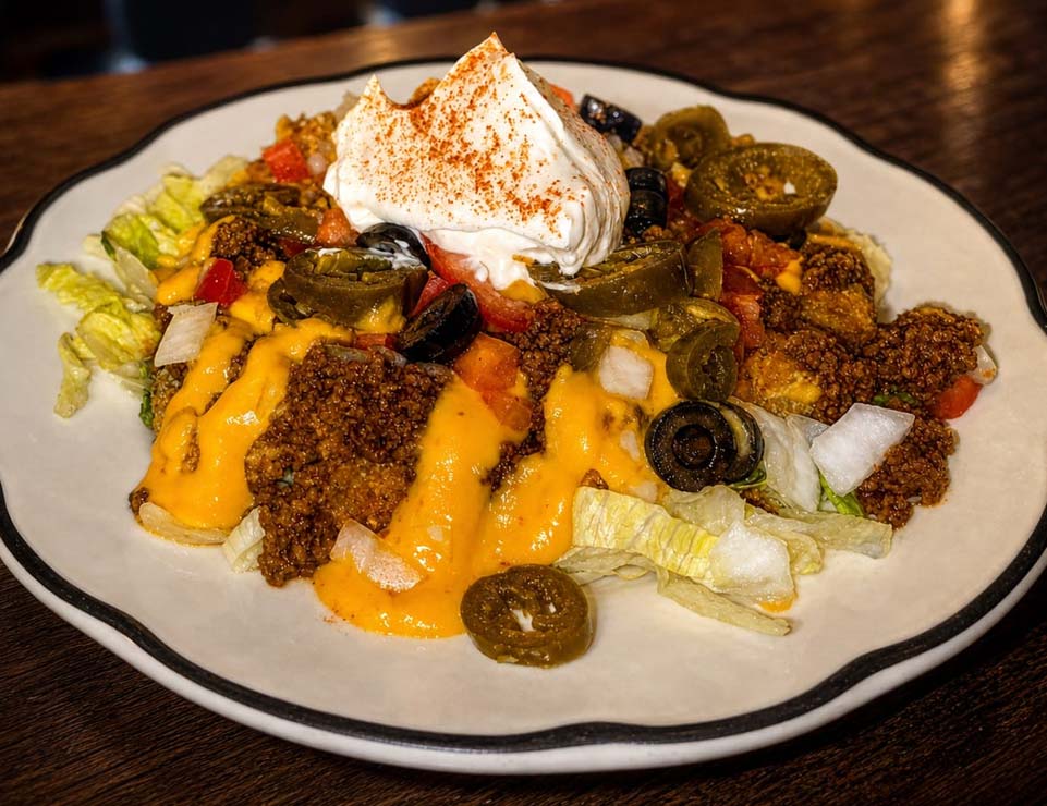 Taco salad with ground beef, cheese sauce, jalapenos, olives, veggies at our Red Wing MN bar.